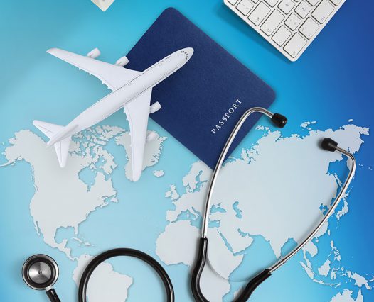 international medical travel insurance concept,stethoscope, passport, computer and airplane on sky background with global map international medical travel insurance concept,stethoscope, passport, computer and airplane on sky background with global map